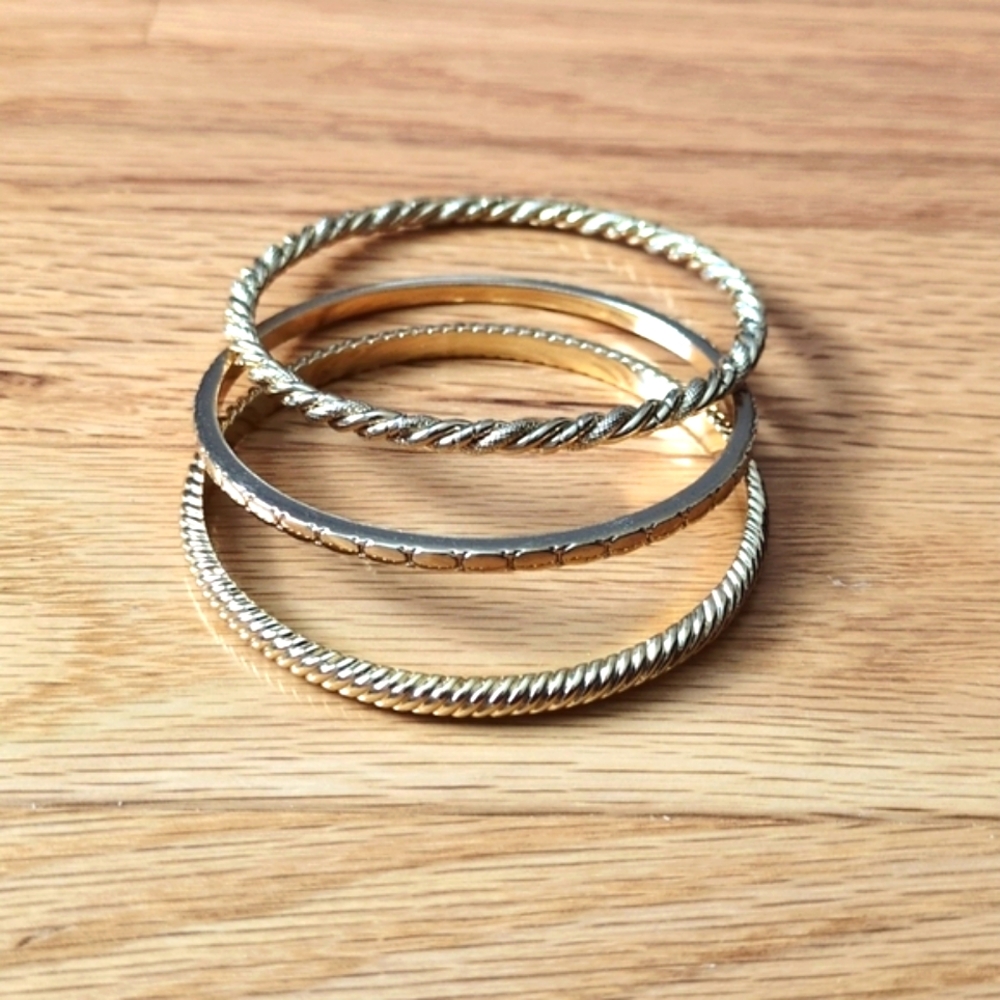 J. Crew gold bangle bracelet stack.